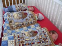 sleeping-trio-in-crib.jpg
